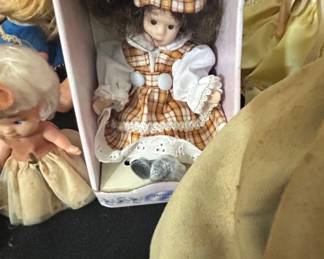 Porcelain Doll in Plaid Dress and Cap