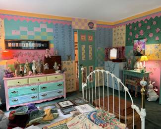 Painted room with furniture and collectibles