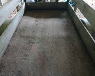 The trailer has a metal bed
