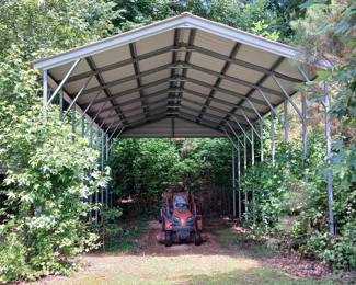 The frame of this metal carport measures 18 ft. x 40 ft and the carport is about 16 ft. tall