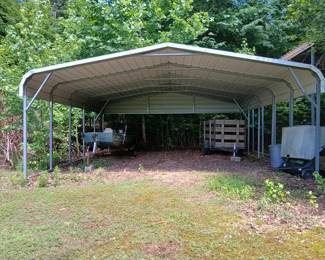 The frame of this metal carport measures 24 ft. by 25 ft. and is about 11 feet tall