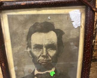 Abe Lincoln print in log cabin frame