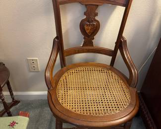 #64 - $60 - Antique walnut chair with heart design back, cane seat 