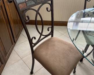 #29 - $250 -Iron glass table round 47" with four chairs tiles accents 