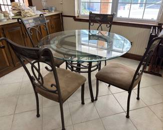 #29 - $250 -Iron glass table round 47" with four chairs tiles accents 