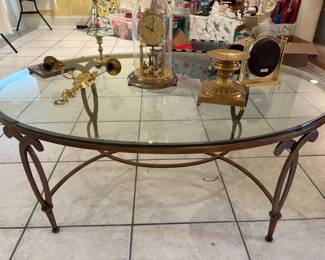 Coffee table with glass top and iron base