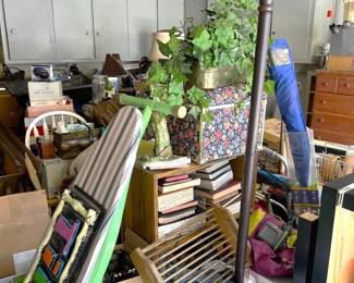 There is a "TIKI BAR" sign on the ironing board, a torchiere lamp, and lots of other possibilities in this picture.