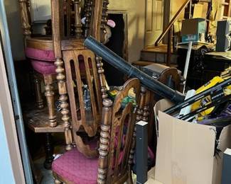 There are a set of matching chairs that likely need some careful attention, but also a table or three. I think there is a shop vacuum hard pipe showing.