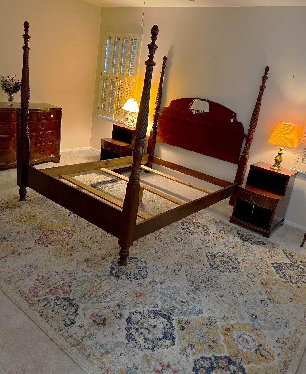 You'll need to supply your own box spring and mattress, but here is a lovely four-poster bed, nightstands, and a dresser.  Don't forget the lamps.