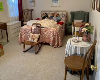 This bedroom set shows the bed, four chairs, a few wall hangings, and a round table (unless you want the tablecloth).