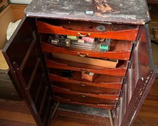 Sewing cabinet with drawers