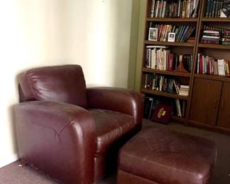 MAROON LEATHER CHAIR WITH OTTOMAN, BOOK SHELVES, BOOKS