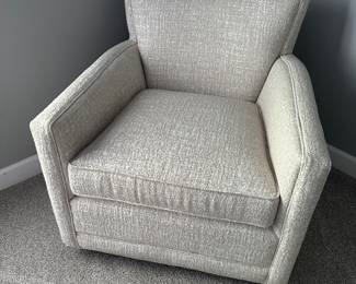 Upholstered swivel rocking chair