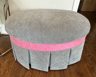 Gray ottoman with pink trim