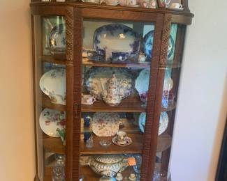Curved front antique china cabinet