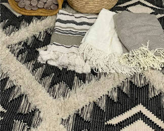 Lot 102: Kenyan Black & white Area Rug, Throw Blankets And Baskets