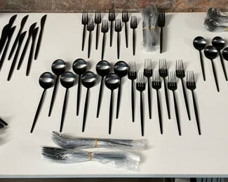 Lot 212: Black Metal Flatware