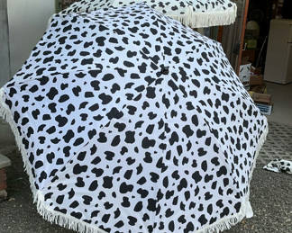 Lot 90: Two Cow Print Patio Umbrellas With Cases