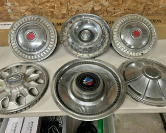 Lot 307: Ambassador car hubcaps and grille pieces