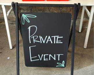 Lot 301: Traffic cones and Private Event chalkboard sign