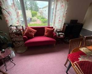 Elegant red couch and stereo system