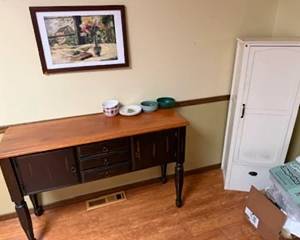 Stylish buffet, kitchen cabinet and art