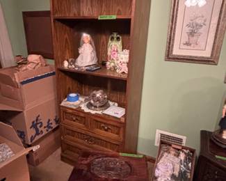 Bookcase and vintage carved wood tea table