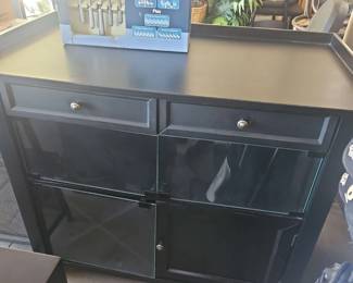 Kitchen Storage Cabinet And A Set Of Oneida Flatware