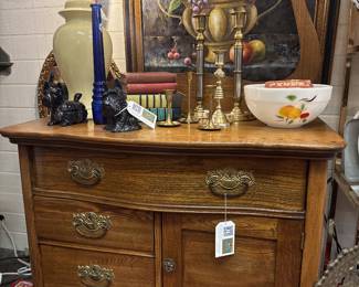 vintage dry sink with towel bar, candlesticks, vintage bowl, dog figurines, large fruit oil paintings