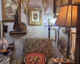 So much to see in every nook & cranny.sconces, framed art, chair, tole tray