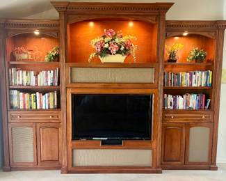 Beautiful entertainment center with built-ins and lighting. Towers measure: 92"H / 37.25" W / 24 3/4"D. Middle measures 100"H / 61" W / 30"D