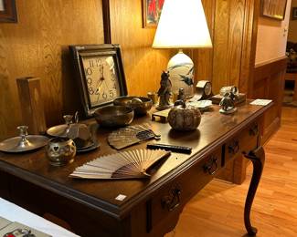 Queen Anne furniture, brass decor