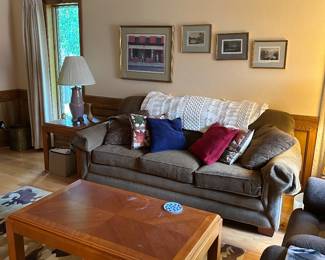 Couch, coffee table, art