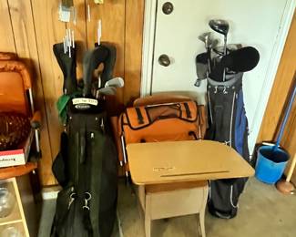 LOTS OF GOLF CLUBS & SCHOOL DESK
