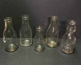116 setoffiveembossedglassmilkbottles