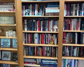 Assorted Books and Decorative Items on a Bookshelf