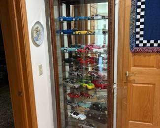 Die-Cast Model Car Collection in Curio Cabinet