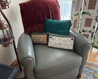 Gray Leather Armchair with Decorative Pillows