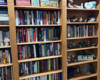 Wooden Bookcase with Assorted Books and Decorative Items