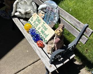 Wooden Garden Bench with Cherub Figurine, Nautical Thermometer Plaque, and Decorative Glass Orbs