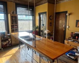 Hung from ceiling floating island sink