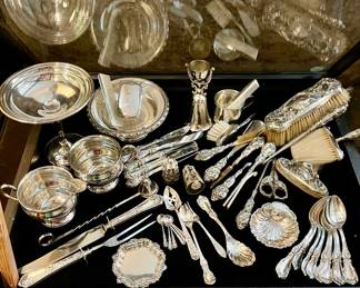 Sterling items in case. Removed daily. Security on premises.
