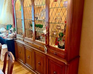 Vintage china cabinet full of crystal, green glass, Waterford.