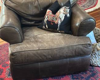 A pair of leather club  chairs by Arhaus Furniture 