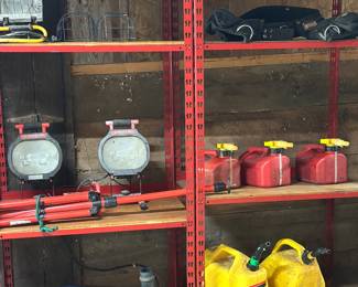 Barn full of misc items : gas cans,  twin head LED work light 