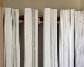 Several  white wood blinds , various sizes 