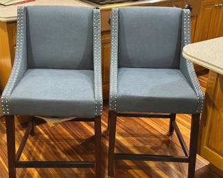 Four Safavieh Dylan counter height barstools with blue linen upholstery 