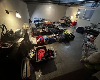 Bins of Men's, Women, and Children's Clothes