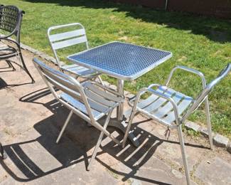 Aluminum table and chairs showing 3 but there are 4 chairs 