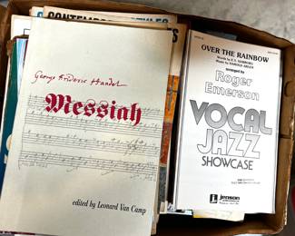 Many tubs full of sheet music